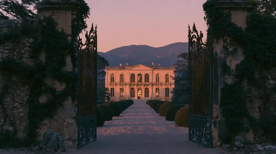 Palace at sunset with a cypress alley